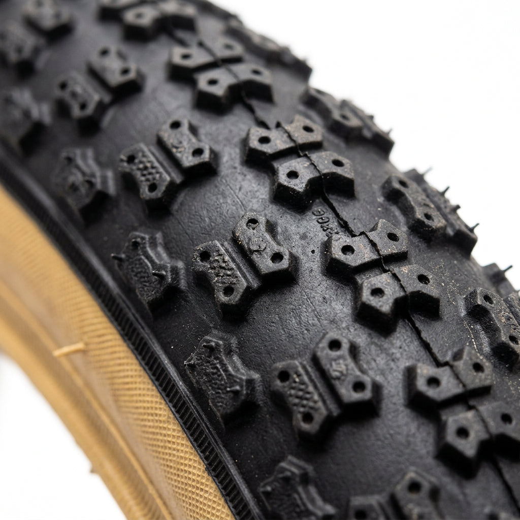 Close-up of the tread pattern on a 16 x 1.75 black bike tyre.