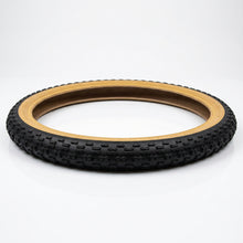 Load image into Gallery viewer, 16 x 1.75 gumwall bike tyre laid flat, showing its circular shape and tan sidewalls.